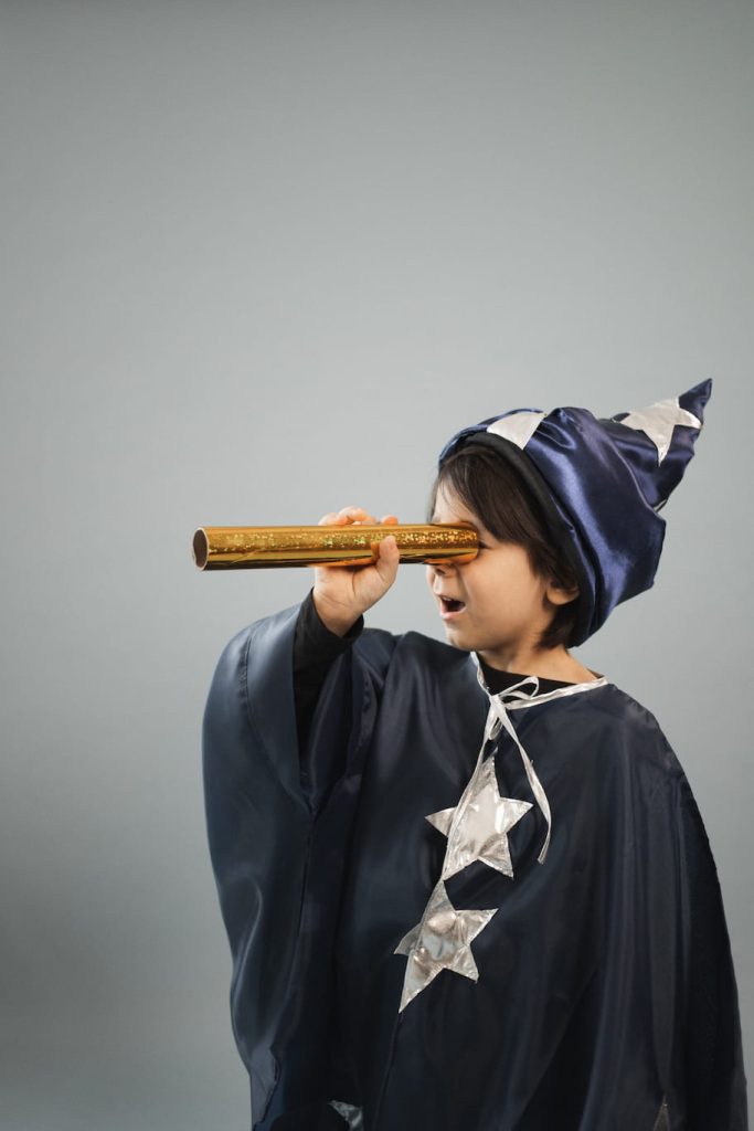boy with imagination dressed as a wizard
